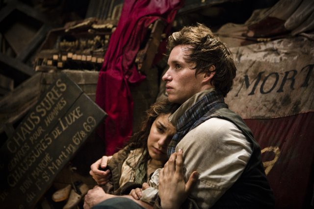 Samantha Barks and Eddie Redmayne star as Eponine and Marius in 'Les Misérables.'