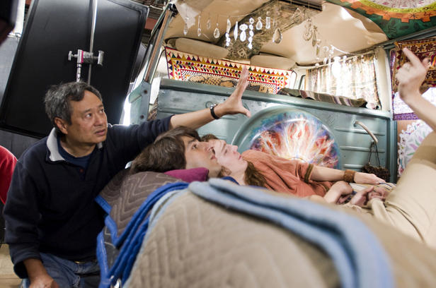 Ang Lee works on a scene in 'Taking Woodstock' with Demetri Martin and Paul Dano.