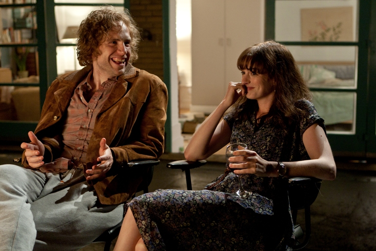 Rafe Spall (left) and Anne Hathaway (right) star as Ian and Emma in the romance ONE DAY, a Focus Features release directed by Lone Scherfig. 
