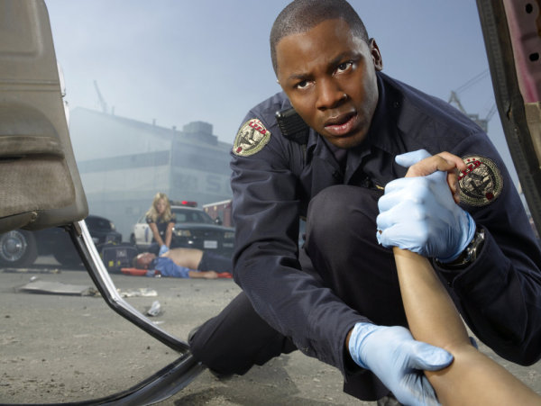 TRAUMA -- Pictured: (l-r) background; Anastasia Griffith as Nancy Carnahan, foreground; Derek Luke as Cameron Boone -- NBC Photo: Michael Muller