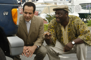 MONK -- "Mr. Monk and the Foreign Man" Episode 8007 -- Pictured: (l-r) Tony Shalhoub as Adrian Monk, Adewale Akinnuoye-Agbaje as Samuel -- USA Network Photo: Hopper Stone 